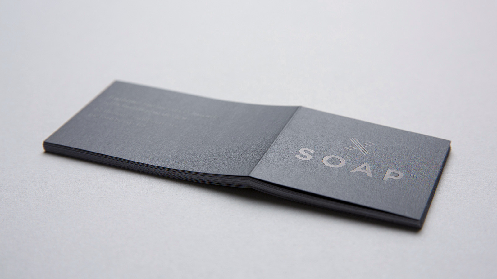 SOAP™ branding – close up of sticker featuring black on black foil