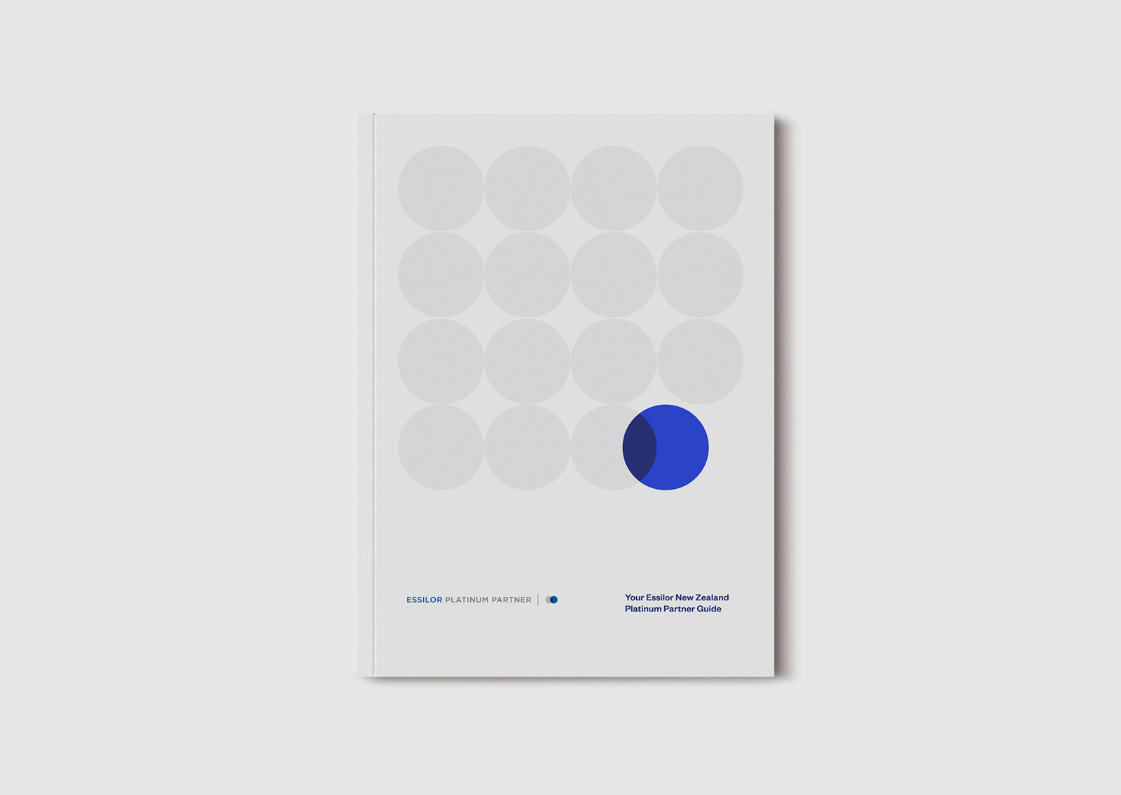 Essilor NZ Platinum Partners brochure – front cover with series of circles and cobalt blue overlap