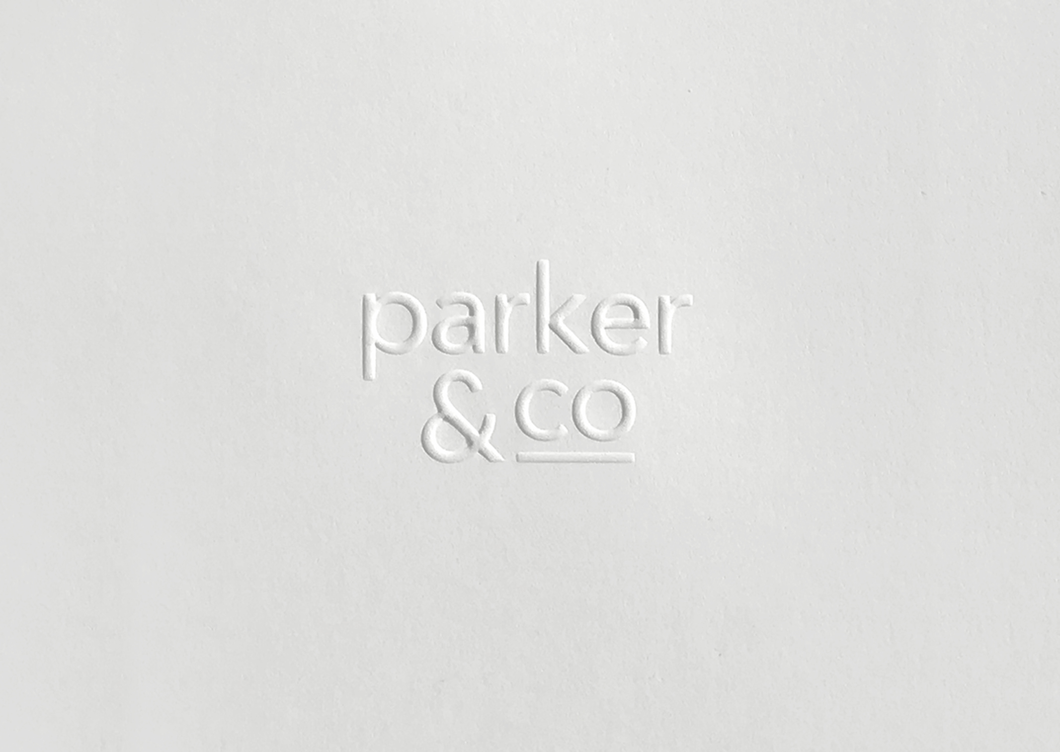 Parker and Co Branded Pocket – close up of blind emboss – white on white