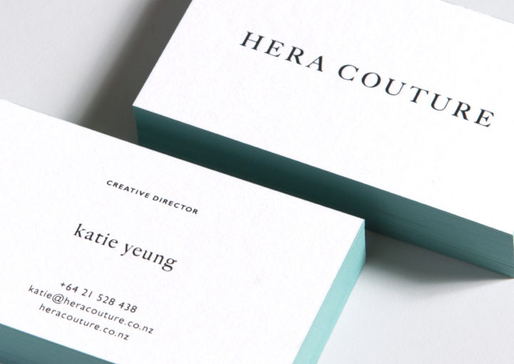 Hera Couture letterpress business cards have aqua painted edges and black foil type