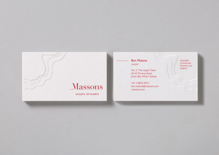 Massons Law business cards feature a deep topographic map emboss and location coordinates