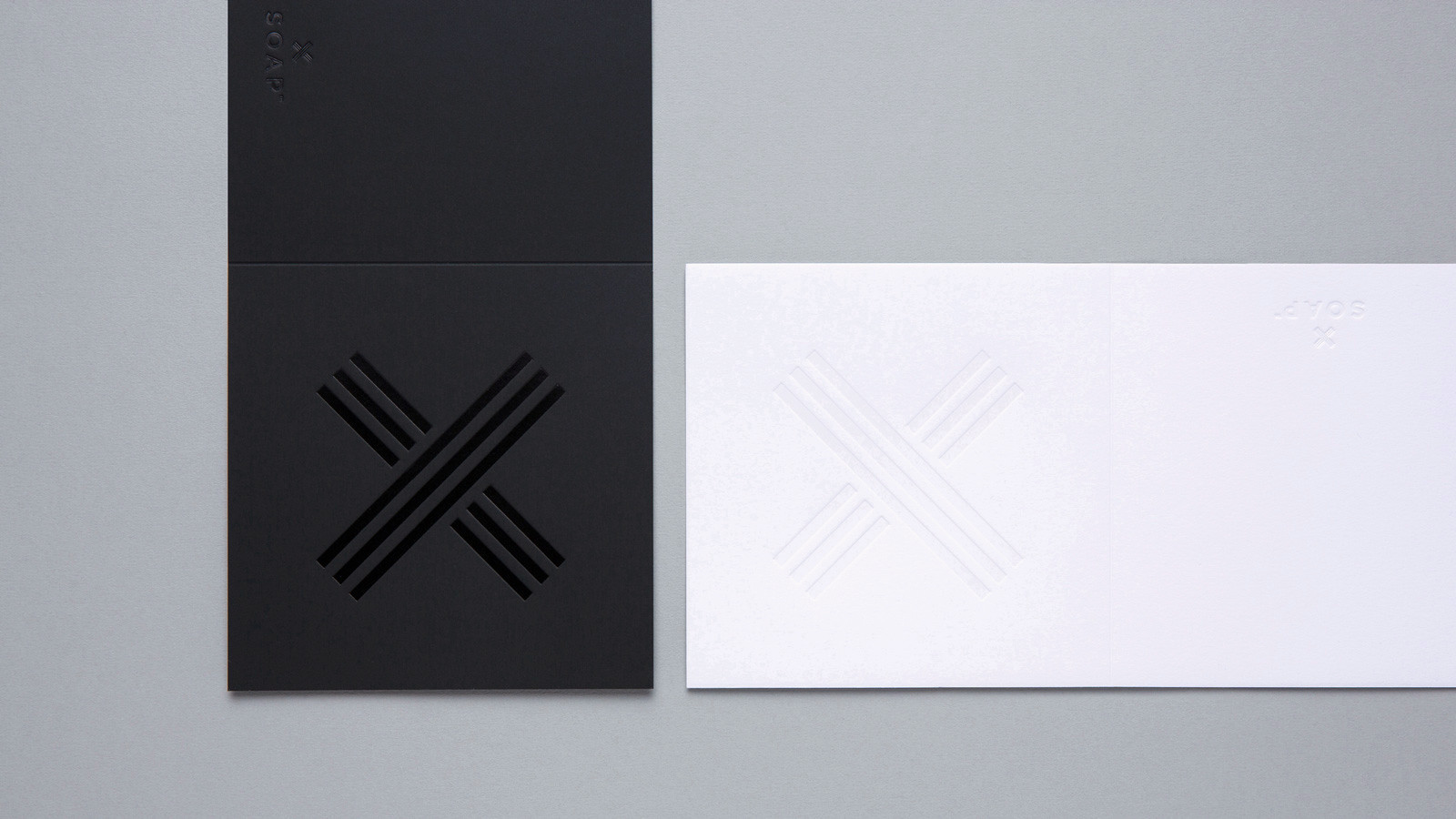 SOAP™ branding – deep embossing with black on black foil and white on white cards