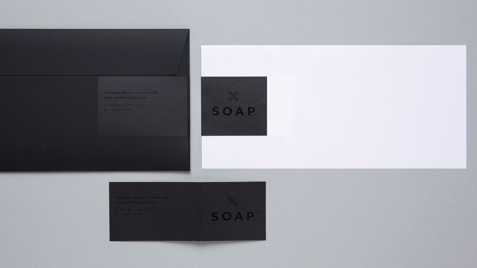 SOAP™ branding – black on black foil sticker on envelope and comp slip